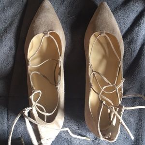 Closed toe, strappy flats. Zips up back.